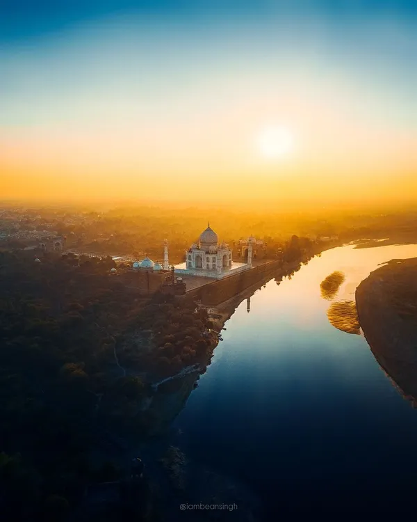 The Taj Mahal at sunset, captured from a safe and legal distance with my drone. The golden light paints the monument and the Yamuna river, creating a soulful and ethereal image of this symbol of love.