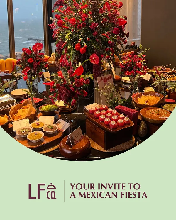 Your invitation to a Mexican Fiesta. We create vibrant, flavor-packed spreads that capture the spirit of Mexico, complete with bold red floral arrangements and a menu full of classics like tacos, nachos, and zesty salsas.