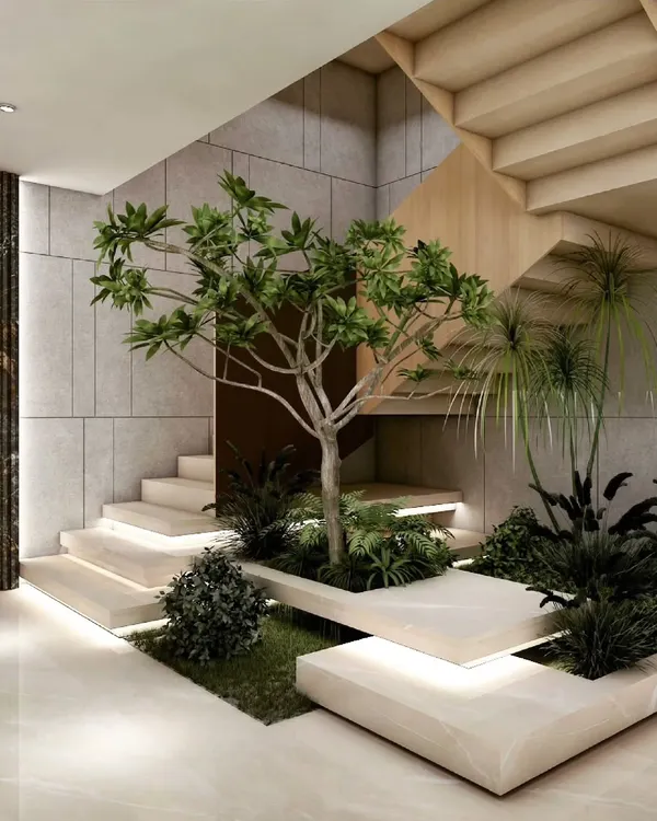 As a centerpiece of our biophilic approach, this indoor garden is built directly into the staircase. It transforms a simple transitional area into a serene, green experience, demonstrating how nature can be woven into the very fabric of a home.