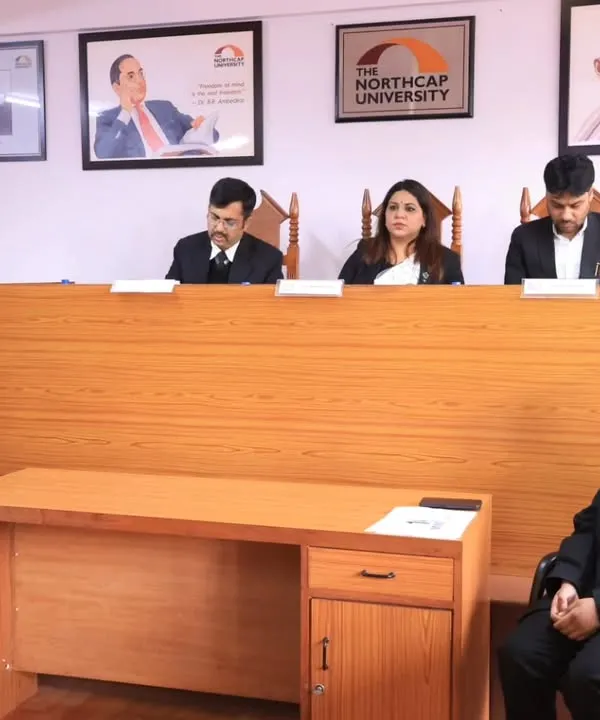 Serving as a judge in the final round of a moot court competition at The NorthCap University. I was impressed by the students' compelling arguments and confident courtroom demeanor.