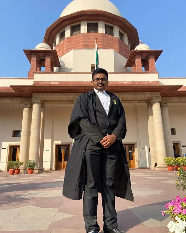In my robes outside the Supreme Court of India. Representing clients at the apex court requires the highest level of diligence and preparation.