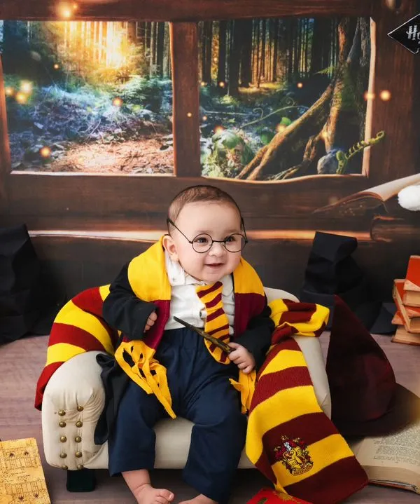 This enchanting Harry Potter setup is one of my specialties, perfect for capturing your little one's magical personality. I provide all the props, from the tiny glasses and scarf to the sorting hat, to create a complete wizarding world in my Delhi studio.