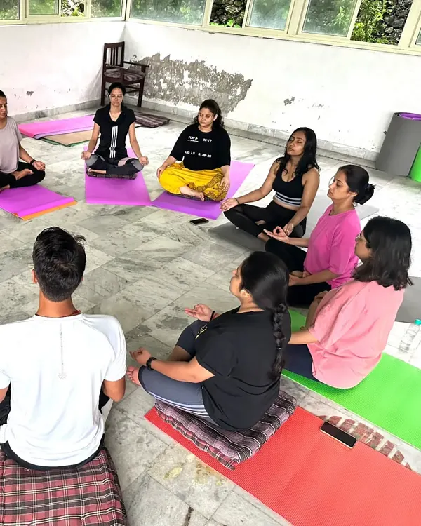A group meditation session during our yoga retreat in Rishikesh. Practicing together in such a spiritually charged environment helps deepen everyone's experience.