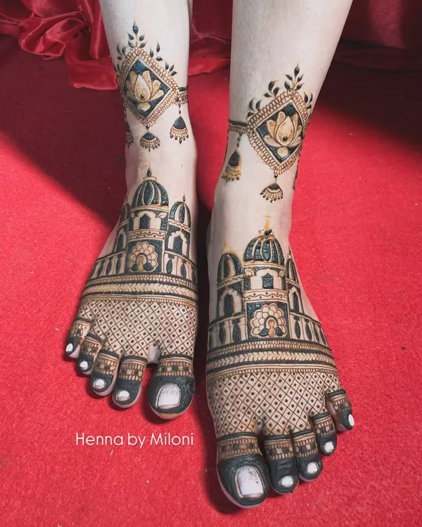 Your bridal look isn't complete without beautiful mehendi on your feet. I designed this intricate pattern featuring architectural domes and delicate lotus danglers to perfectly complement the bride's overall look.