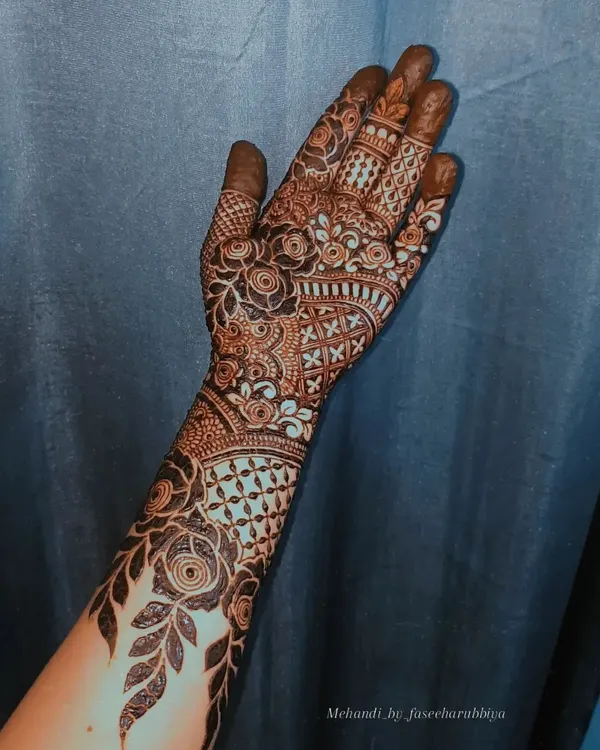 A beautiful floral henna design with a mix of bold and fine lines.