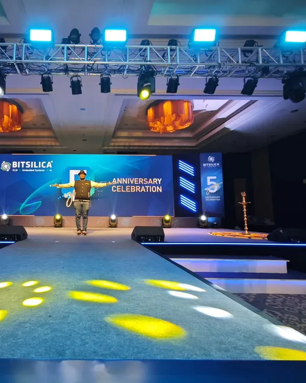 A clean, professional setup for a corporate anniversary celebration. The stage features a large LED screen for branding and presentations, flanked by a powerful sound system, all designed to create a premium awards night experience.