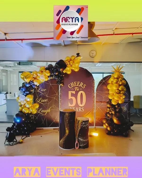 We designed this elegant photo backdrop for Paras Defence's 50th anniversary celebration in their Nerul office. The theme "Cheers to 50 Years" was brought to life with custom panels and sophisticated balloon art.