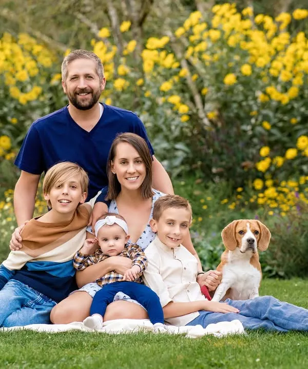 A perfect family portrait with everyone, including their handsome beagle, nestled among a field of yellow summer flowers. Capturing big, happy groups like this is one of my greatest joys.