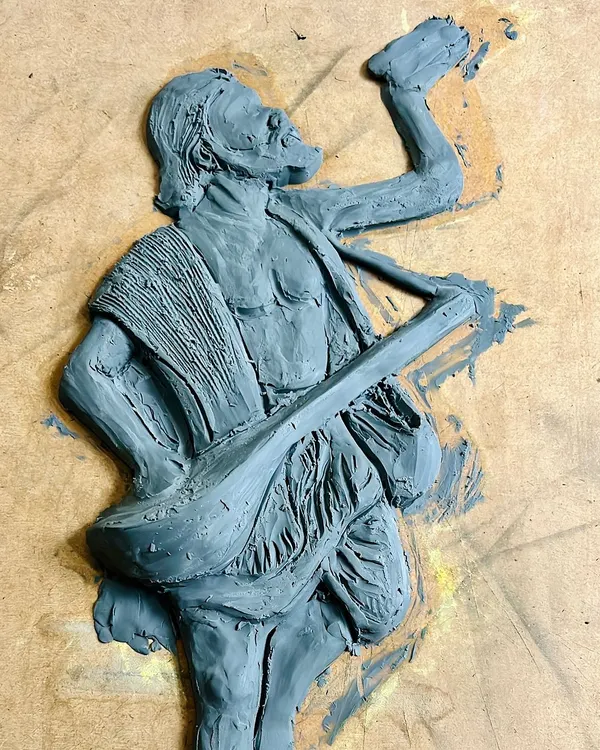 The beginning of a 3D mural. Here, I have sculpted the main figure of Kanaka Dasa onto a board using clay. This is the foundational layer, capturing his dynamic pose and emotion before any details are added.