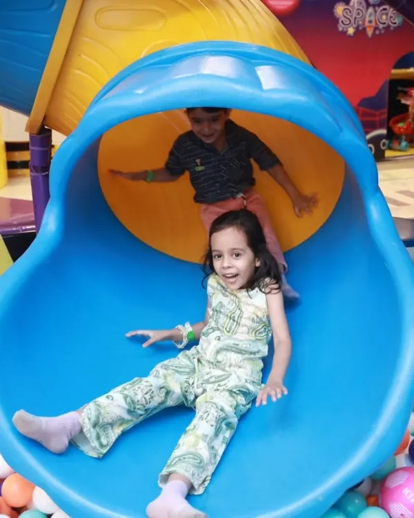 Welcome to Fun Orbbit, where every slide ends with a huge smile. We've designed our play area to be a world of adventure, and this colorful slide into a giant ball pit is a favorite for kids of all ages.
