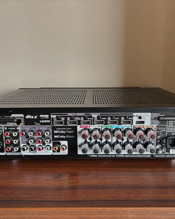 This is the back of the Marantz Cinema 70s AV receiver. It shows all the connection ports needed for a multi speaker Dolby Atmos system. A clean and correct wiring job is crucial for performance, and it's something I take great pride in.