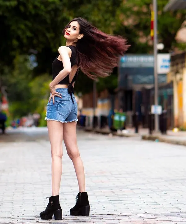 Capturing motion and energy on the streets of Bangalore. This full-length shot uses the empty street as a runway, creating a dynamic fashion photograph.