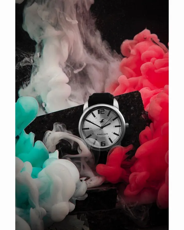 This creative shot for a watch brand uses colored smoke and dramatic lighting to create a memorable, high-impact visual for advertising campaigns. We handle complex setups to produce images that stand out.