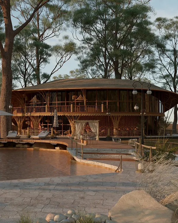 I designed the Driftwood Resort to feel like a natural extension of its 3.5-acre landscape. This view captures the main structure, built with raw wood and earthy materials, overlooking the organically shaped pool, creating a seamless dialogue between the architecture and the surrounding forest.