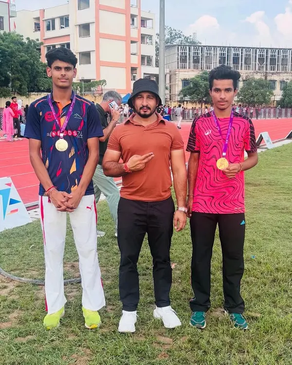 Standing proud with my athletes after their victory at the Open Delhi Athletics Championship. Their gold medals are a testament to their dedication and trust in the process.