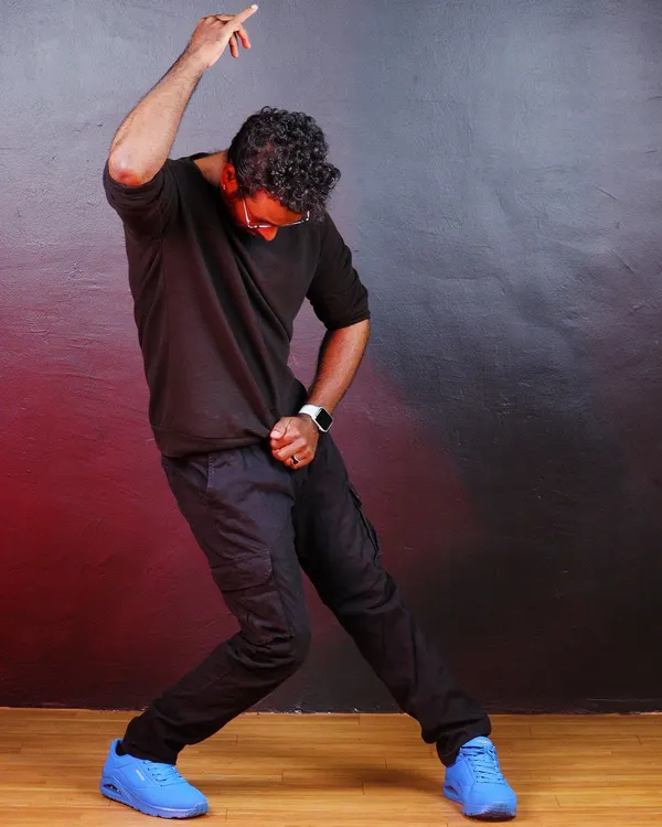 A signature GKStyle pose captured during a photoshoot. Dance is about creating powerful shapes and telling a story with your body.