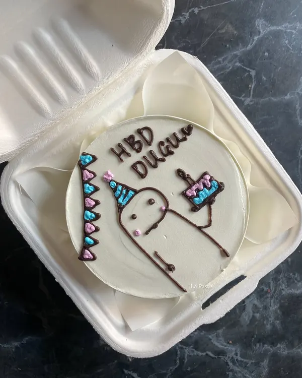A cute hand-drawn character bento cake for a birthday. I love bringing your fun and quirky ideas to life on these mini cakes.