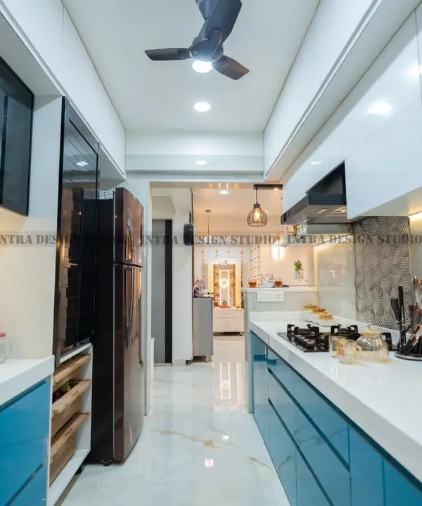 This parallel modular kitchen in Ulwe is a perfect example of how we combine style and function. The vibrant blue acrylic finish is paired with a clean white countertop and smart storage solutions like tandem drawers and rolling shutters, making it a joy to use every day.