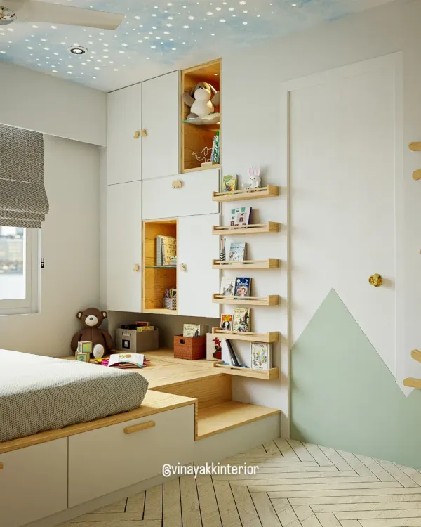 This kids' room is all about maximizing a compact space. A raised platform bed includes under-drawer storage, while the adjacent steps double as a bookshelf, creating a fun and functional reading nook.