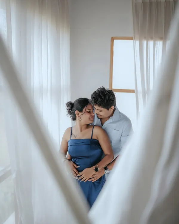"Tum se." A beautifully framed, intimate portrait of a couple sharing a quiet moment indoors, with soft light filtering through the curtains.
