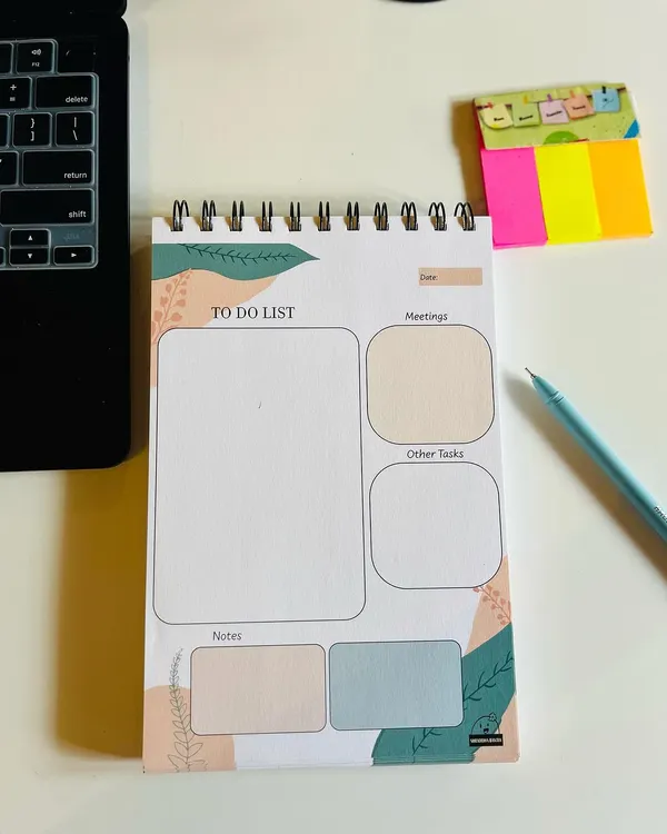 My undated 'To Do List' pad, perfect for organizing your tasks, meetings, and notes. It's spiral-bound and comes with a free pen.