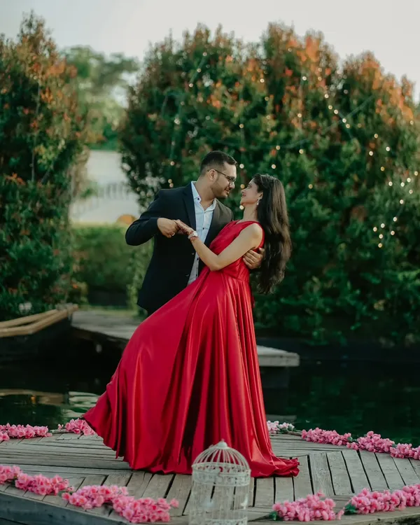 A fairytale dance on a wooden deck surrounded by flowers and fairy lights. This shot of Nikhil and Anisha in their formal attire is pure romance.