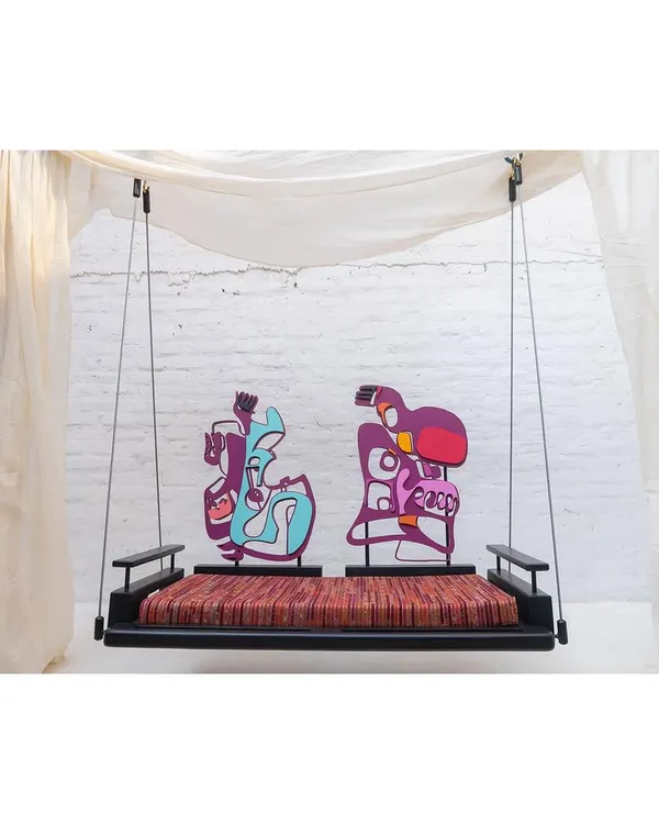 The 'Kaleidochaos' swing, a collaboration where we turned a functional furniture piece into interactive art. The modular backrests are our own sculptural creations, designed to be moved and reconfigured by the user.