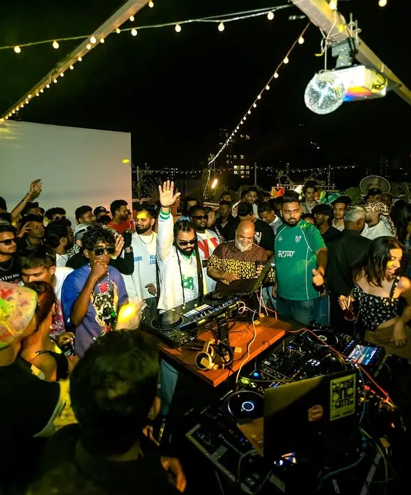 The view from behind the decks at my 'Block Party Vol. 1'. A packed rooftop, good music, and the whole community coming together.