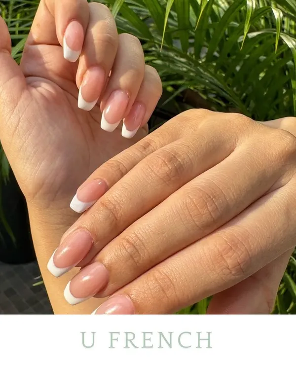 A classic U-shaped French manicure. This set features clean, traditional white tips on a perfectly shaped square nail, showing how timeless and elegant this style is.