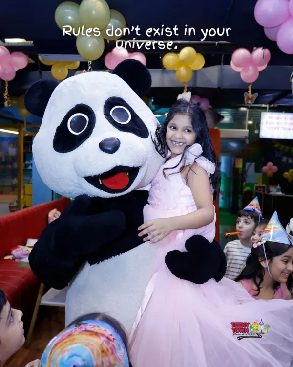 A birthday girl gets a big hug from our friendly panda mascot. These surprise visits make for the most memorable photos and moments.