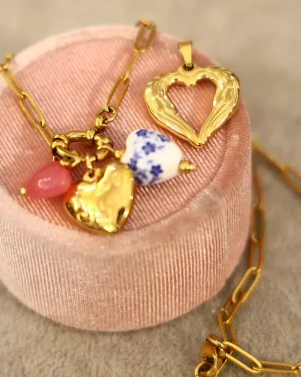 Say it with style. This Valentine's Day collection features delicate gold-plated chains and a variety of heart-shaped charms, including hammered gold and blue-and-white porcelain. It is the perfect personalized gift or self-love treat.