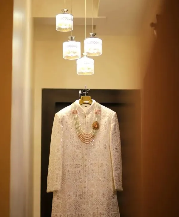 A perfect shot of the groom's wedding sherwani, elegantly displayed before the ceremony begins. Capturing the details of the attire is essential to telling the complete story of the day.