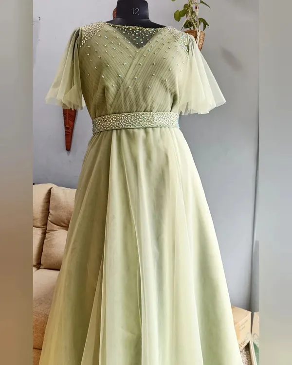 This elegant sage green gown is a perfect example of a final student project, showcasing advanced draping, delicate net work, and intricate hand embellishments. It represents the professional quality and finish I teach and deliver in my custom designs.