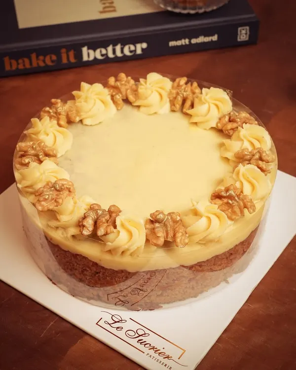 This classic Carrot Cake has it all: a moist crumb, warm spices, sweet carrot flavor, and crunchy walnuts, all topped with a rich cream cheese frosting.