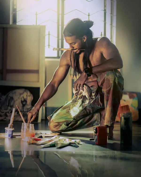 Art isn't always clean. Here I am on the studio floor, completely absorbed in the process of creating. This is where the passion for painting takes over.