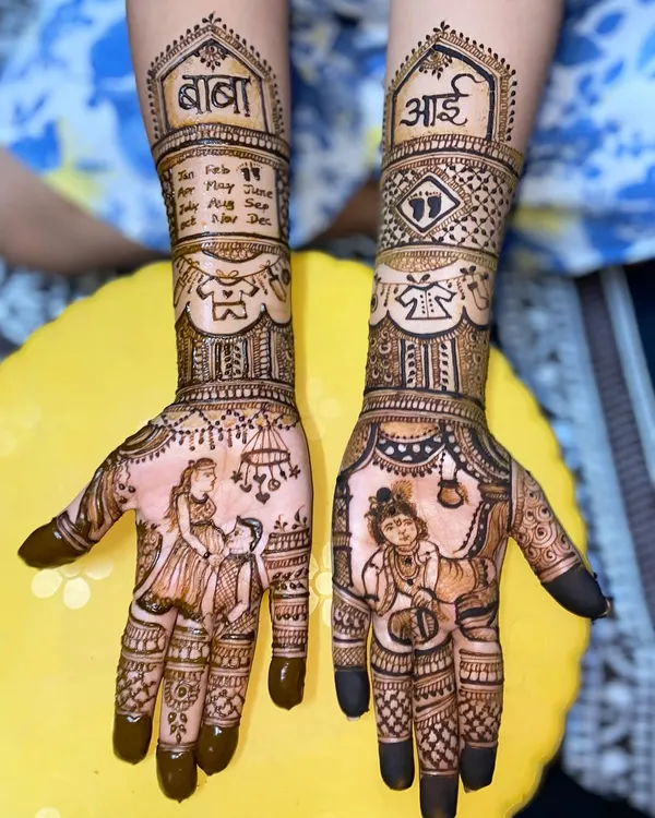 This custom baby shower mehandi tells a beautiful story, featuring portraits of the parents-to-be, the words 'आई' (mother) and 'बाबा' (father), and a depiction of baby Krishna. I love creating these unique designs that celebrate your most special moments.