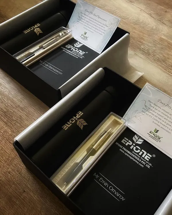 A client onboarding gift we curated for Epione Pharma. This sleek black box contains a personalized pen set, a branded flask, and a custom welcome note to build a strong professional relationship from day one.