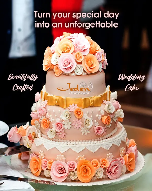 A masterpiece for a milestone moment. This three-tiered wedding cake features delicate peach and pink sugar flowers cascading down its elegant form, finished with a touch of gold for a truly luxurious statement.