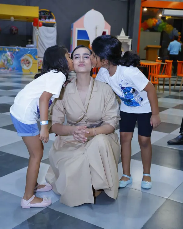 There's nothing better than a mother's love. This heartwarming moment captures the special bond between a mom and her children during a fun day out.