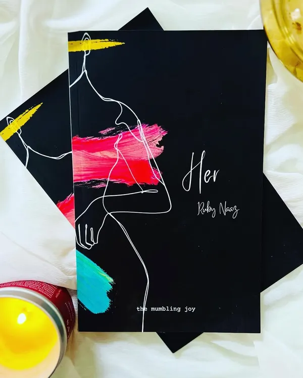 My debut poetry book, 'HER', written for the feminine in all of us. Holding this in my hands was a dream come true. It's a collection of poems that are raw, honest, and deeply personal.
