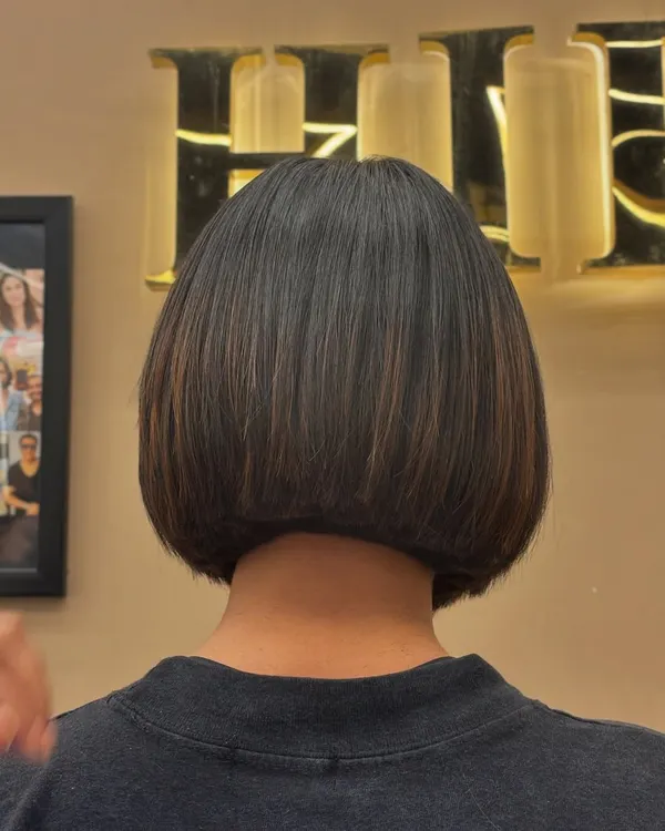A back view of a sleek bob haircut, showing the clean lines and precision of the cut. This is a timeless style that is both chic and easy to maintain.
