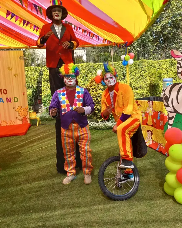 I can create a full carnival experience for your event. This team of performers includes a stilt walker, a juggling clown, and a unicyclist, ready to entertain guests at a birthday party or family fun day.