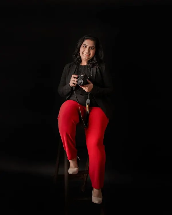 Hello, I'm Sneha! This is me in my happy place, camera in hand, ready to capture your family's precious moments. I pour my heart into every session and feel so lucky to do what I love.