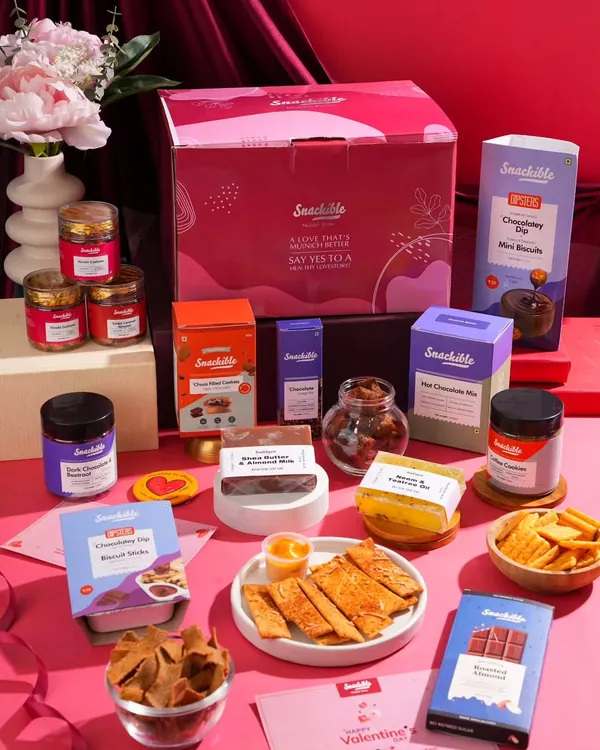 This is a full product lineup for a Valentine's Day snack box. I arranged all the items to look like an abundant, exciting gift, showcasing the entire collection in one comprehensive shot.