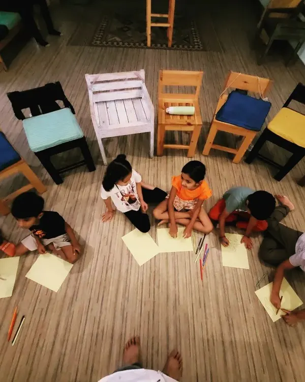 An overhead view of our little artists at work. After the story is over, we spread out on the floor for a fun, collaborative art session where everyone can draw what the story inspired in them.