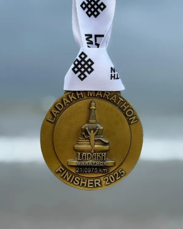 The coveted finisher medal from the Ladakh Half Marathon. Running at high altitude presents a unique challenge that our athletes train specifically for.
