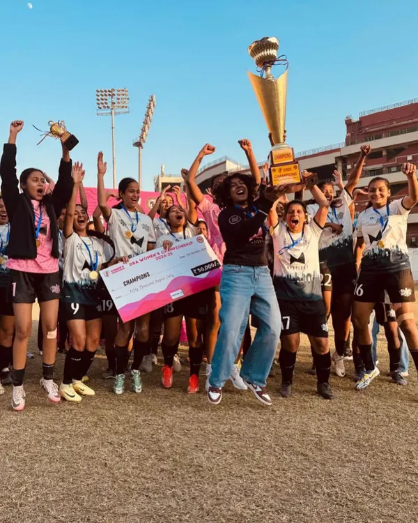 The moment of victory. Our Dream Team Women erupt in celebration after being crowned champions, lifting the trophy high. This is the result of relentless spirit and unwavering belief in each other.