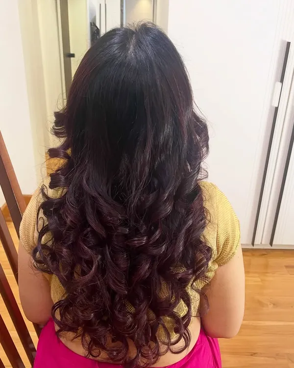 I love creating these voluminous, defined curls. This hairstyle was done on my client Anita's own hair, giving it body and movement.