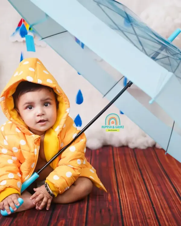 "Let the rain sing you a lullaby." Our monsoon mini-shoot is a fun way to celebrate the season, with a cute raincoat and umbrella.
