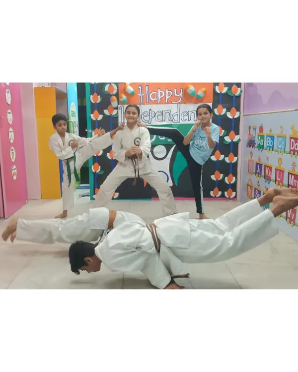 Our young warriors are a testament to the fact that discipline and strength have no age limit. This image captures our students demonstrating advanced bodyweight control and kicking techniques during a group session.